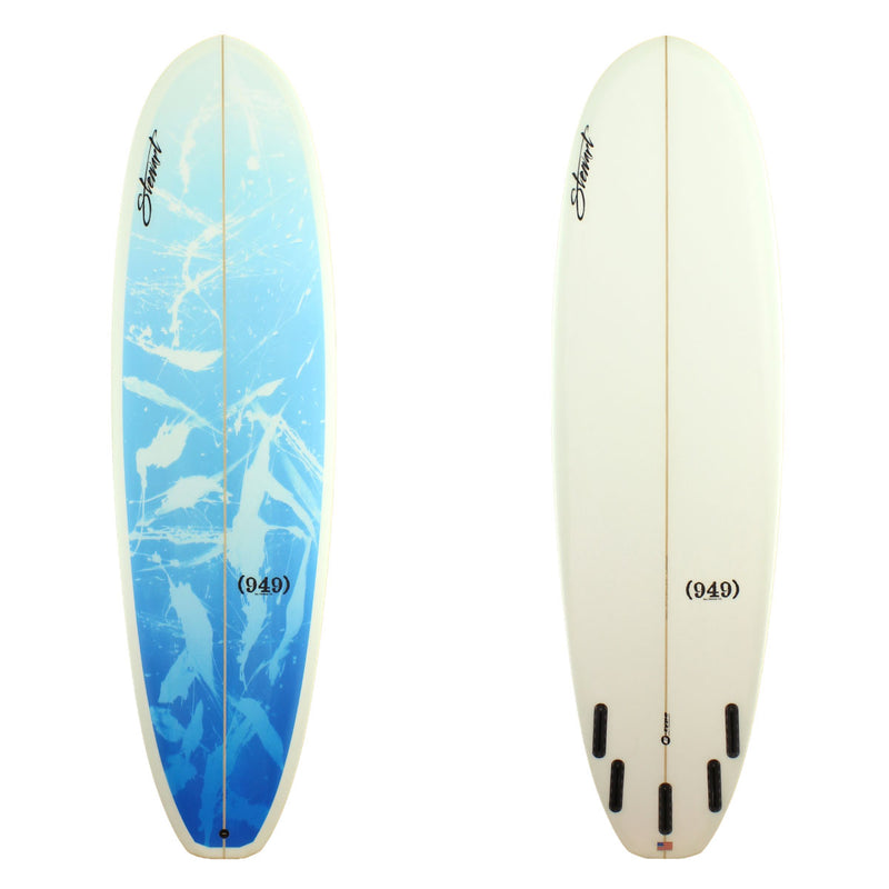 Stewart Surfboards 7'2" (949) mid-length surfboard with blue splatter deck panel and clear white bottom and rails