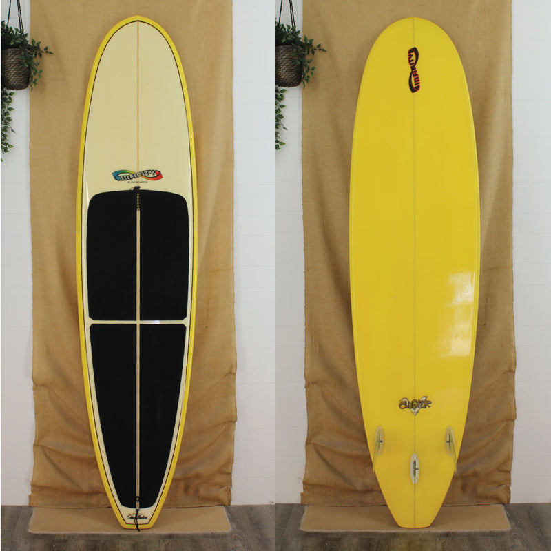 Deck and bottom view of a used Infinity Mid length with yellow rails and bottom and a gloss and polish finish 