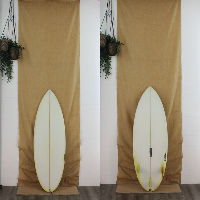 Deck and bottom view of a used Polmer Shortboard with a little bit of yellow on the tail and sand finish 