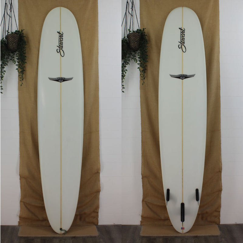 Deck and bottom view of a used Stewart Mighty Flyer Longboard with sand finish and no color work