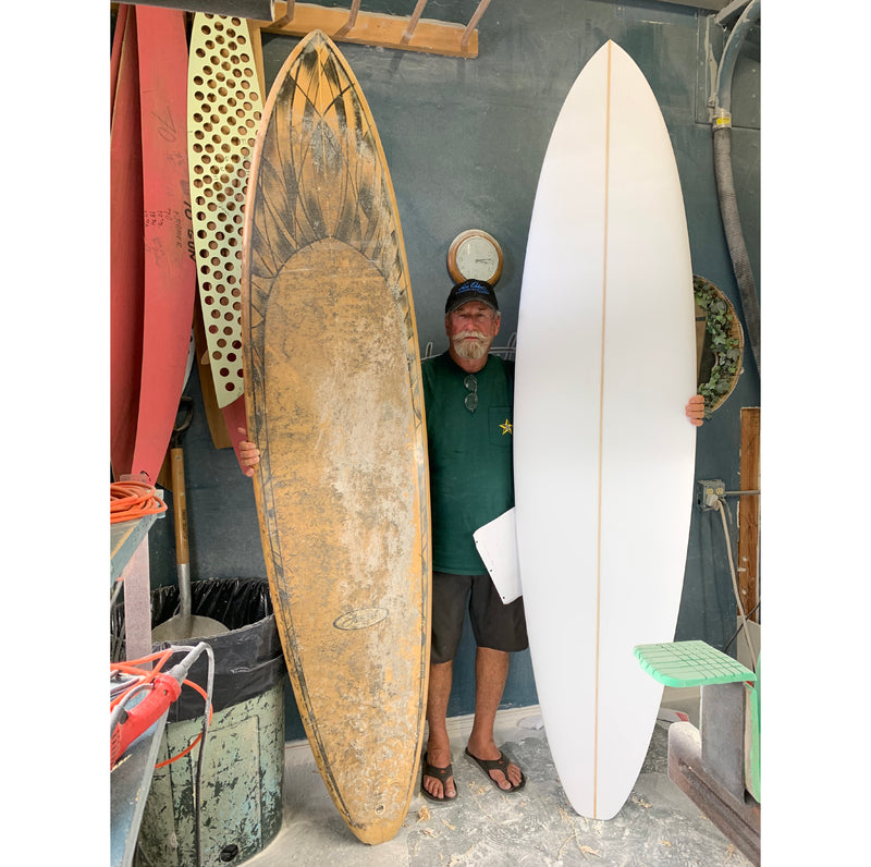 Bill Stewart with hand-shaped surfboard remake of old surfboard
