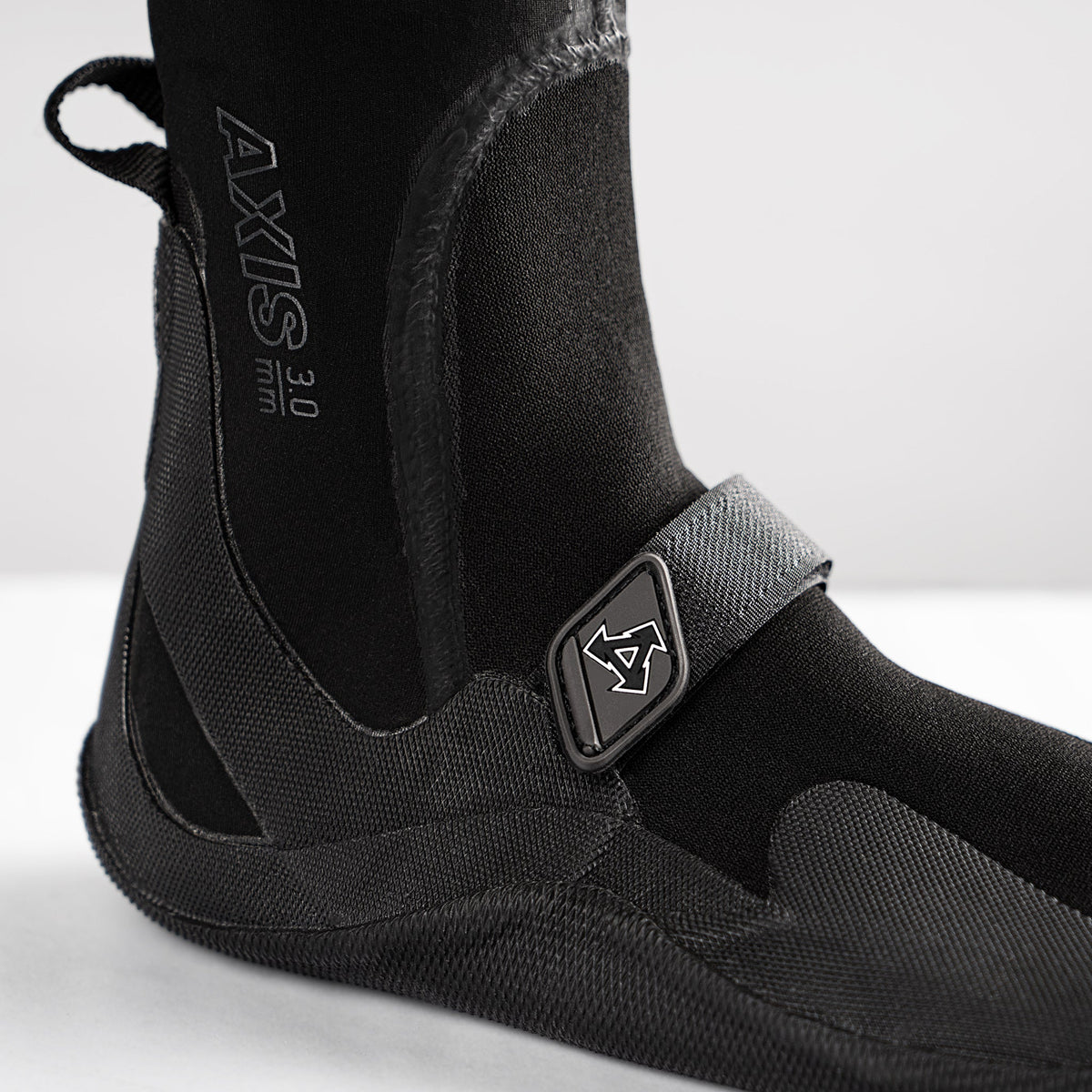 Black wetsuit boot with 'Axis' branding on a white background