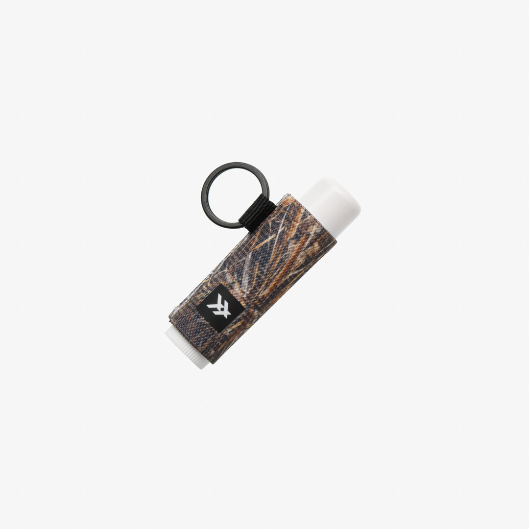 Keychain with a small bottle on a white background