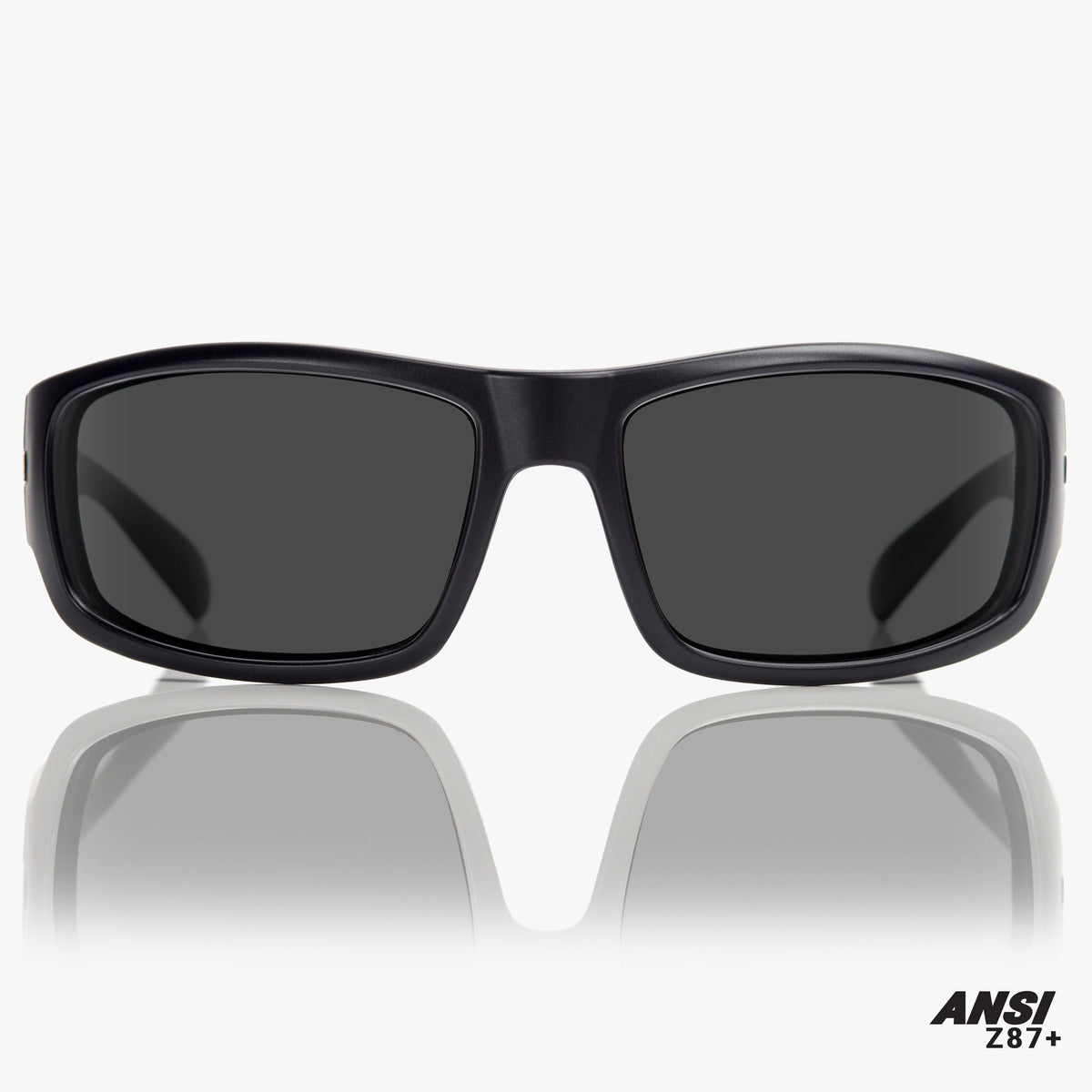 Black sunglasses with dark lenses on a white background, featuring ANSI Z87+ label.