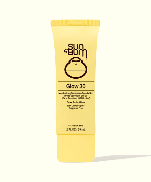 Yellow tube of SUN BUM GLOW 30 Sunscreen Face Lotion with text and branding on the label.
