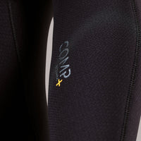 Close-up of a black wetsuit with a brand logo on a white background