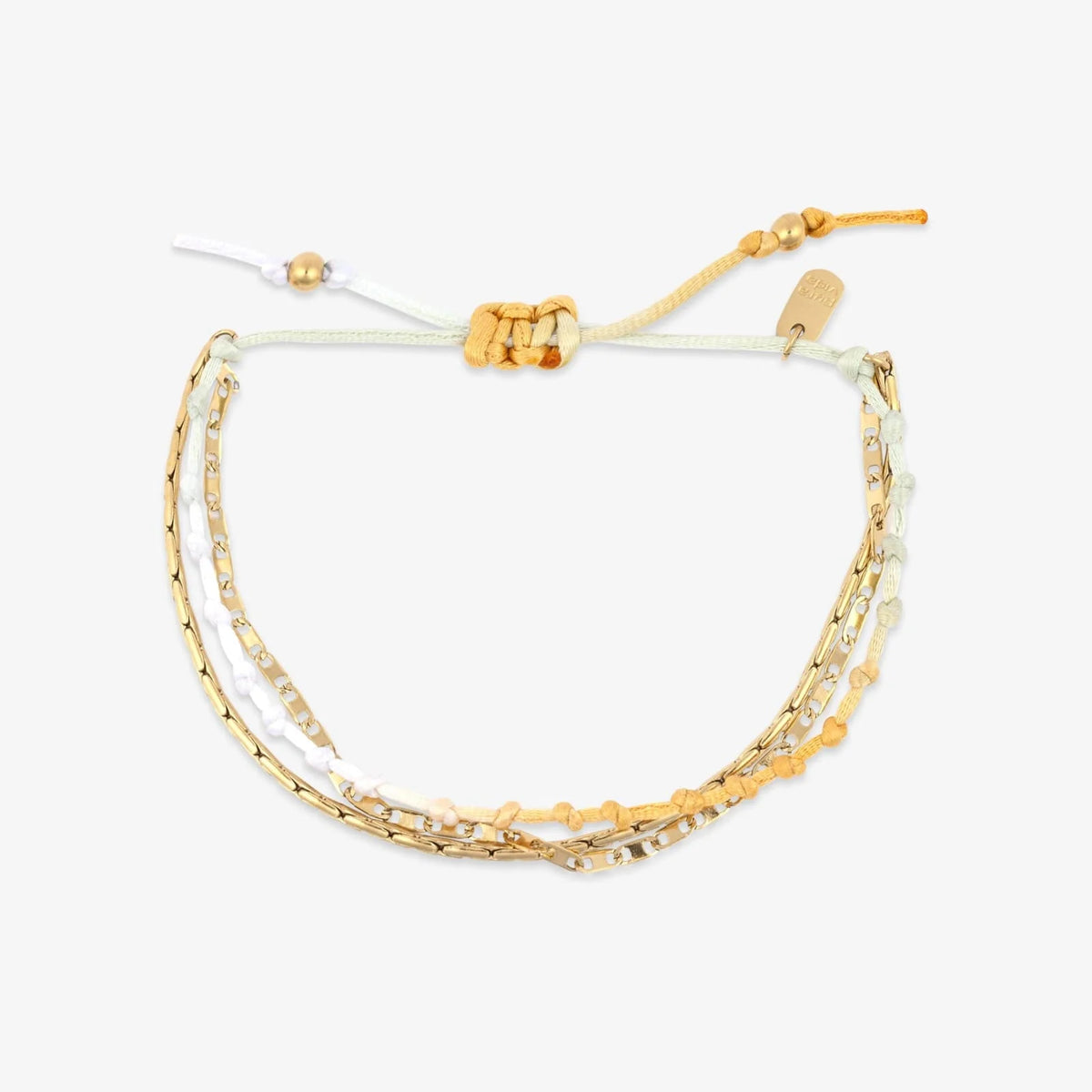 three layer bracelet combines vibrant ombre thread with a sleek snake chain and textured mirror chain for the perfect balance of soft color and gold detail