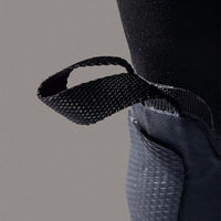 Close-up of a textured black strap on a gray background
