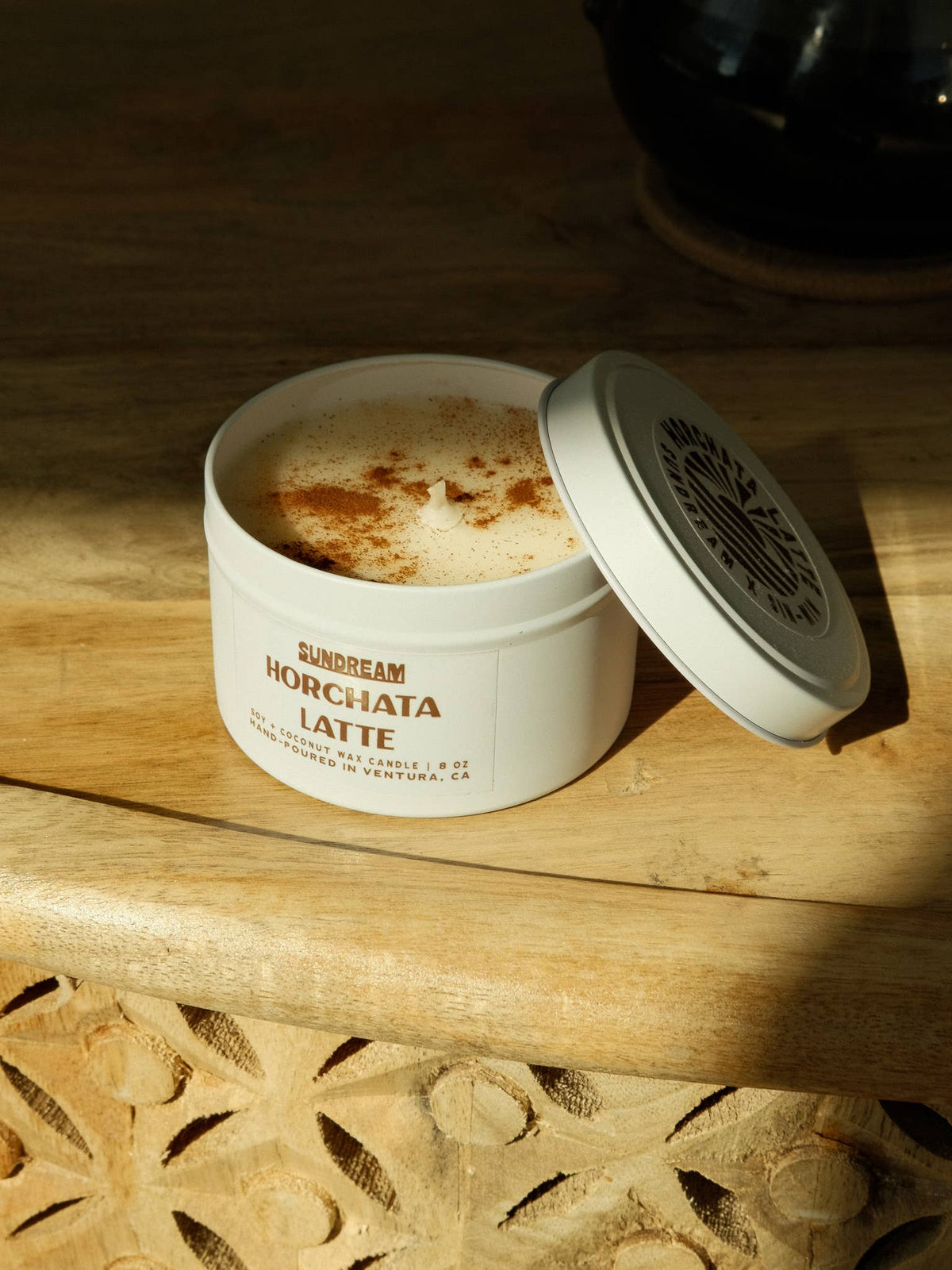 Container of Horchata Latte on a wooden surface