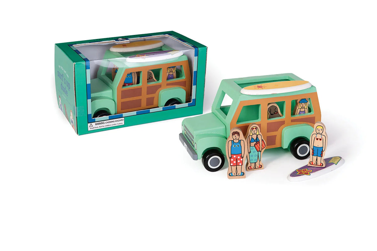 Toy van with figures and surfboard, next to its packaging on a white background
