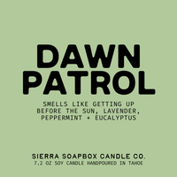 Label for Sierra Soapbox Candle Co. candle with 'Dawn Patrol' scent description on a green background