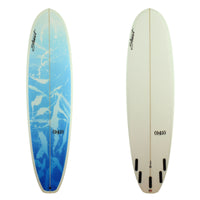 Stewart Surfboards (949) mid-length surfboard with blue abstract painted deck panel, and clear white bottom