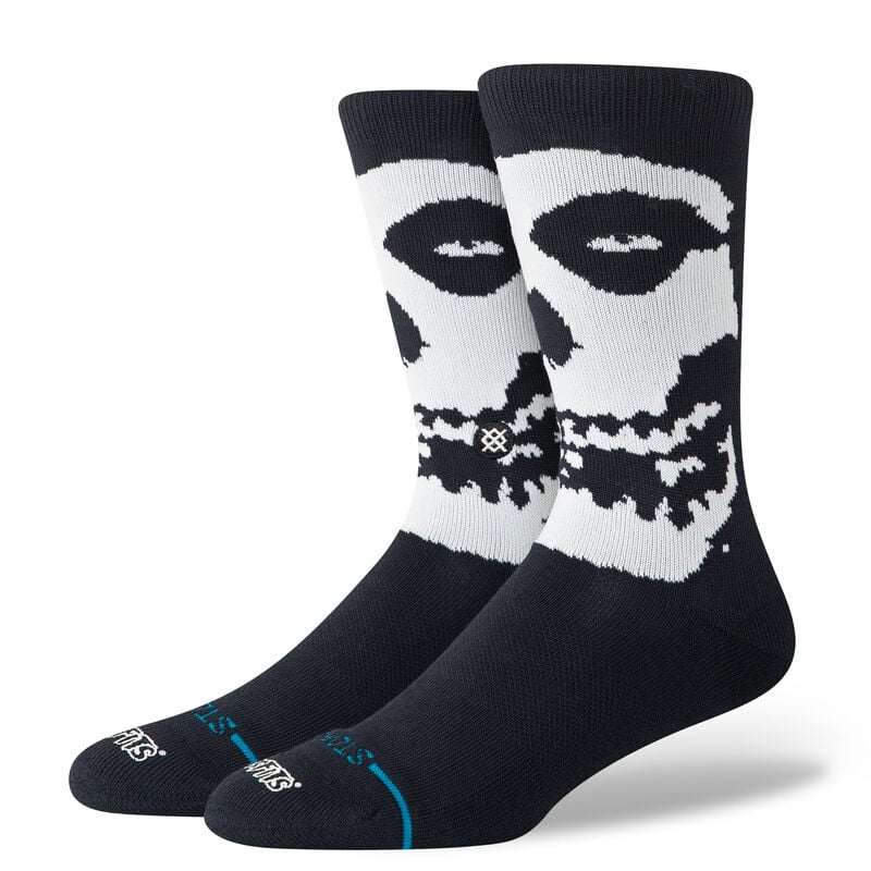 Stance Socks. Black and white socks with skull design on a white background