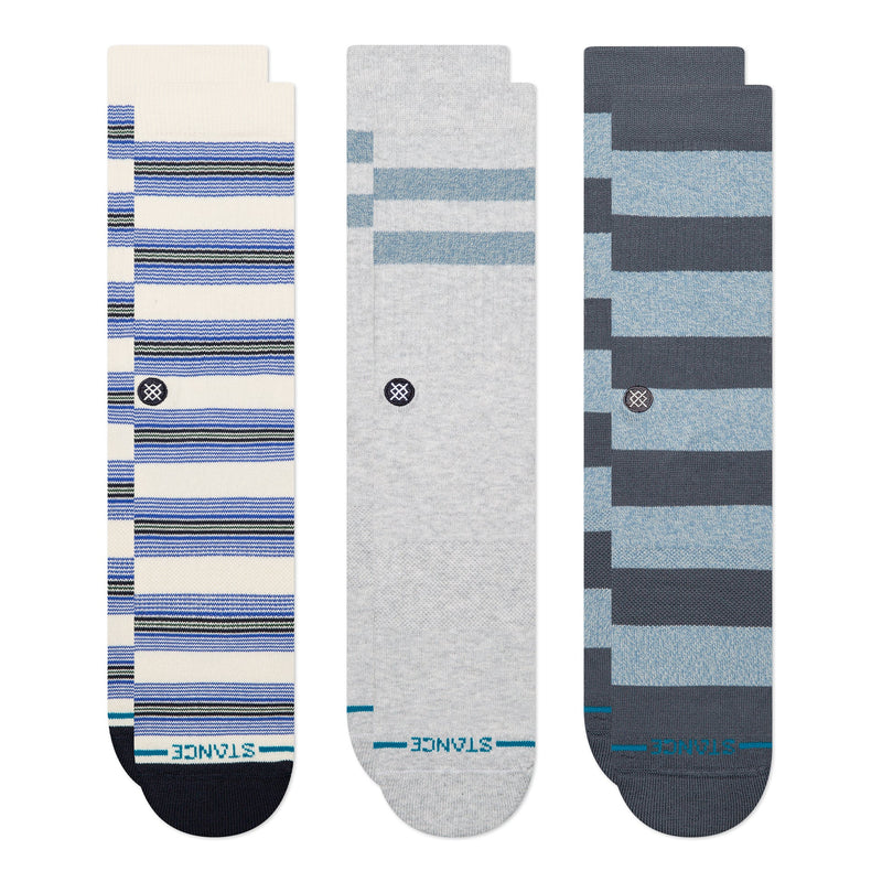 Three pairs of striped socks in blue, gray, and white on a white background