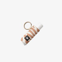 Keychain with striped design and logo on a white background