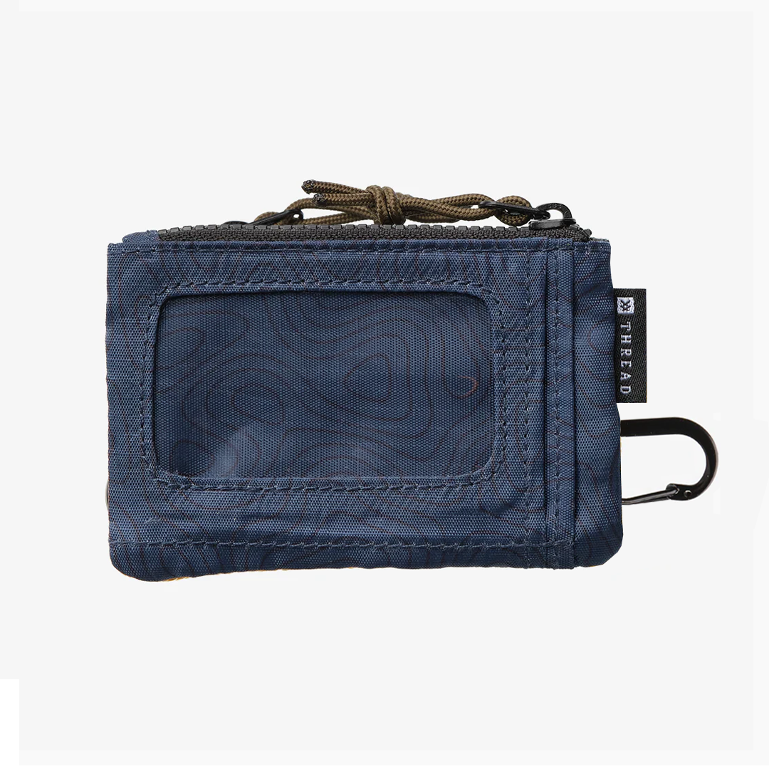 Blue wallet with a visible brand logo on a white background