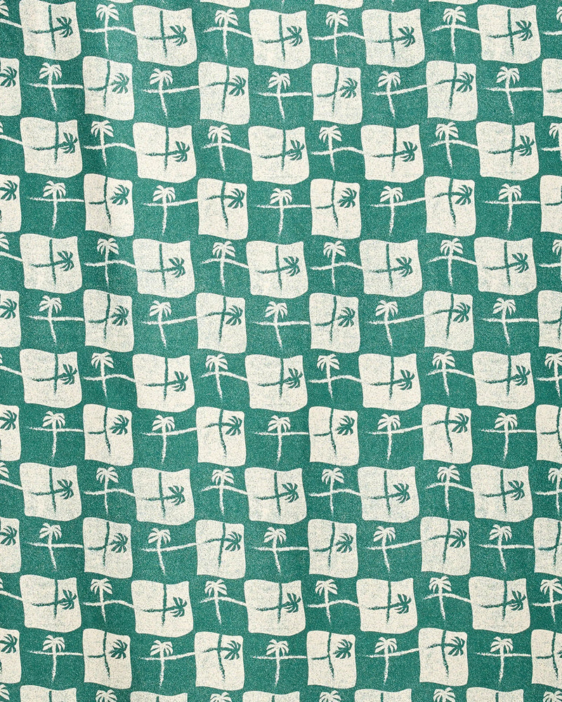 Pattern of white squares with palm trees on a green background