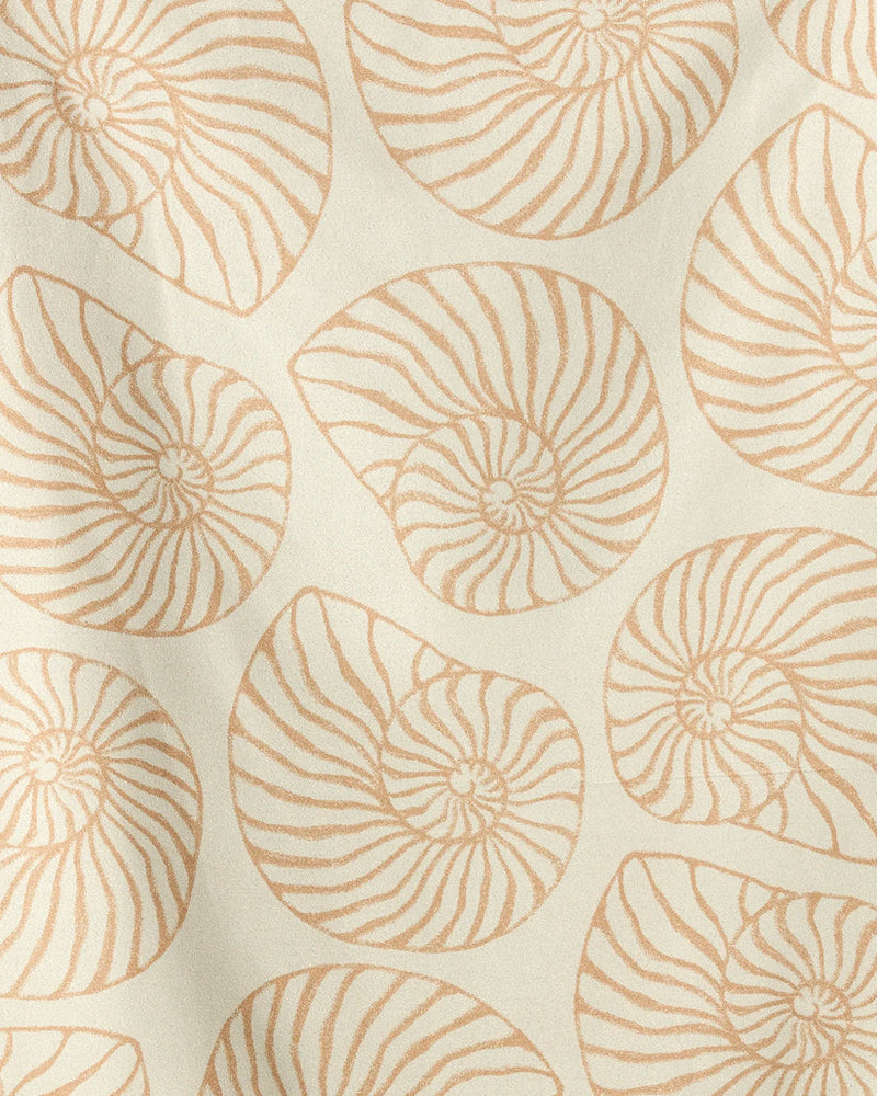 Pattern of shell-like shapes on a beige background