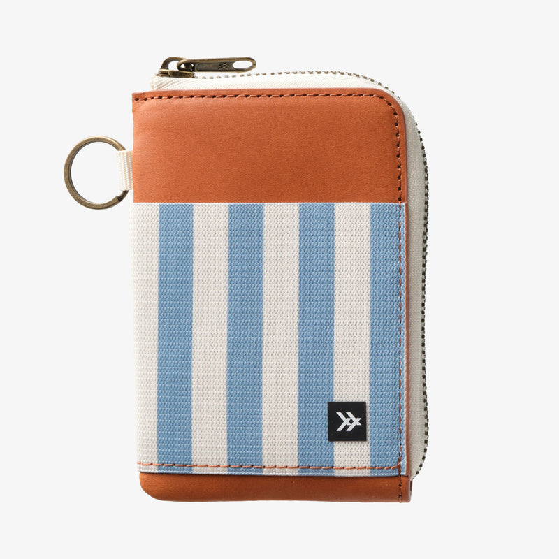 Small wallet with blue and white striped design on a white background