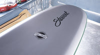 bottom, rail view of the Stewart HydroCush Redline 11 longboard soft top surfboard with beveled rails and light grey bottom