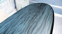 detail view of the bottom of the Stewart HydroCush Wild Bill soft top mid length surfboard with slate/black swirl bottom