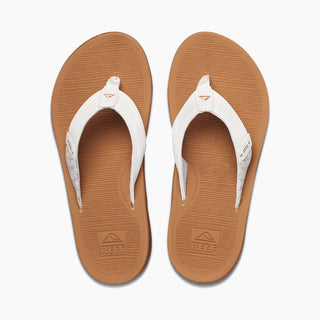 A pair of beige REEF Santa Ana women's sandals with white straps.