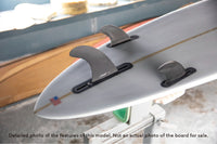 detail of tail and fins included on Stewart CMP longboard surfboard