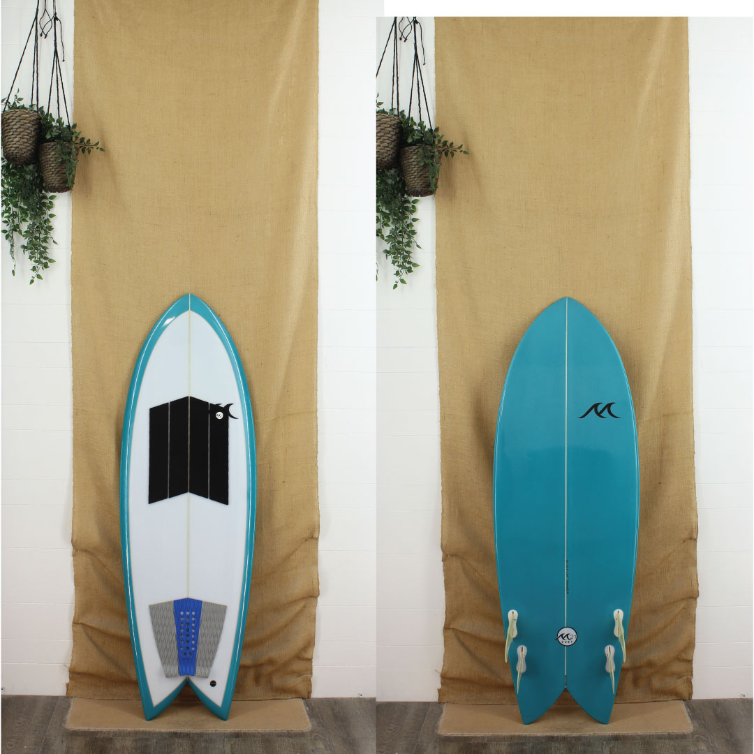 Deck and bottom view of a used M21 Quad Fish with blue rails and a bottom and a gloss and polish finish 