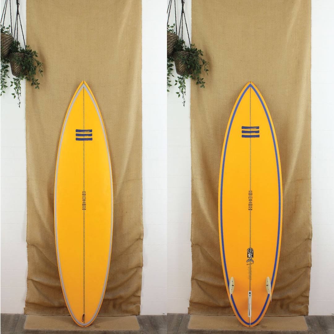 Deck and Bottom View of Evolution Gun shortboard thats yellow with blue stripes on the rails with a sand finish 