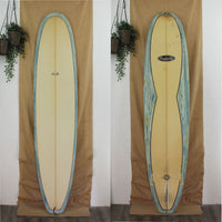 Deck and Bottom view of a used Rockin Fig longboard with blue and white swirled rails. Sand finish