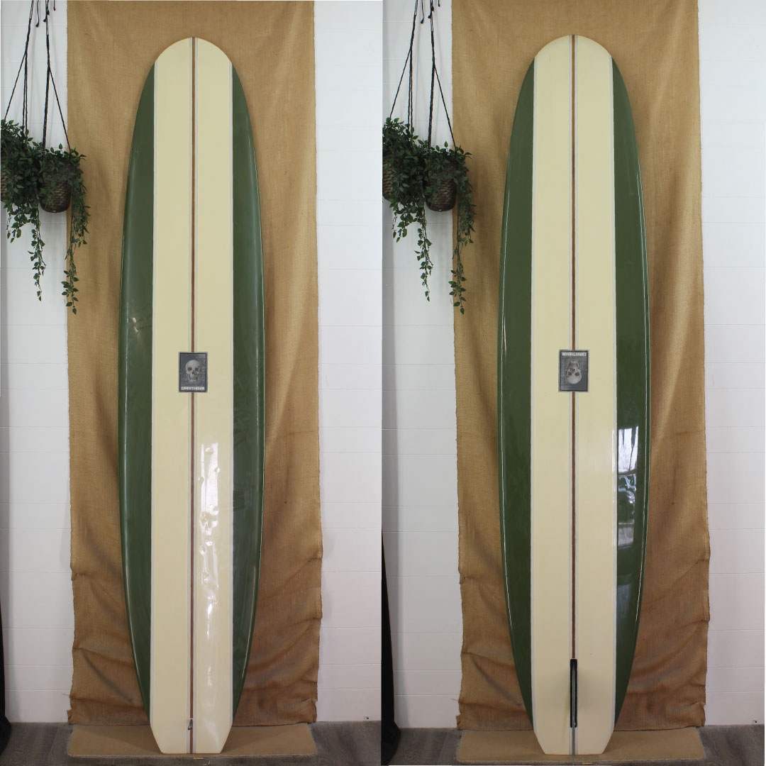 Deck and bottom view of a Christensen longboard with forest green  panels on the rails with off white panels in the center. Skull logo in the center of stringer.