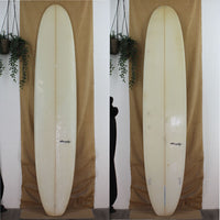 Deck and bottom view of a clear murphy longboard with a 2 + 1 fin set up