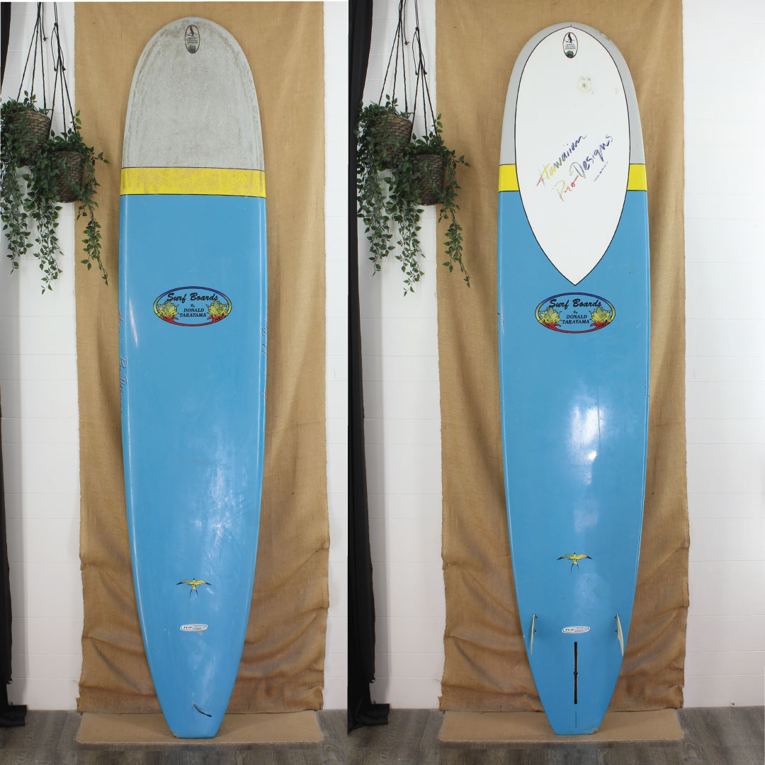 Deck and bottom view of donald takayama with blue and yellow paint on bottom 