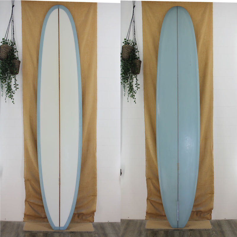 DXTR 9'9" x 23 7/8" x 3" Poly Longboard blue bottom and rails tint