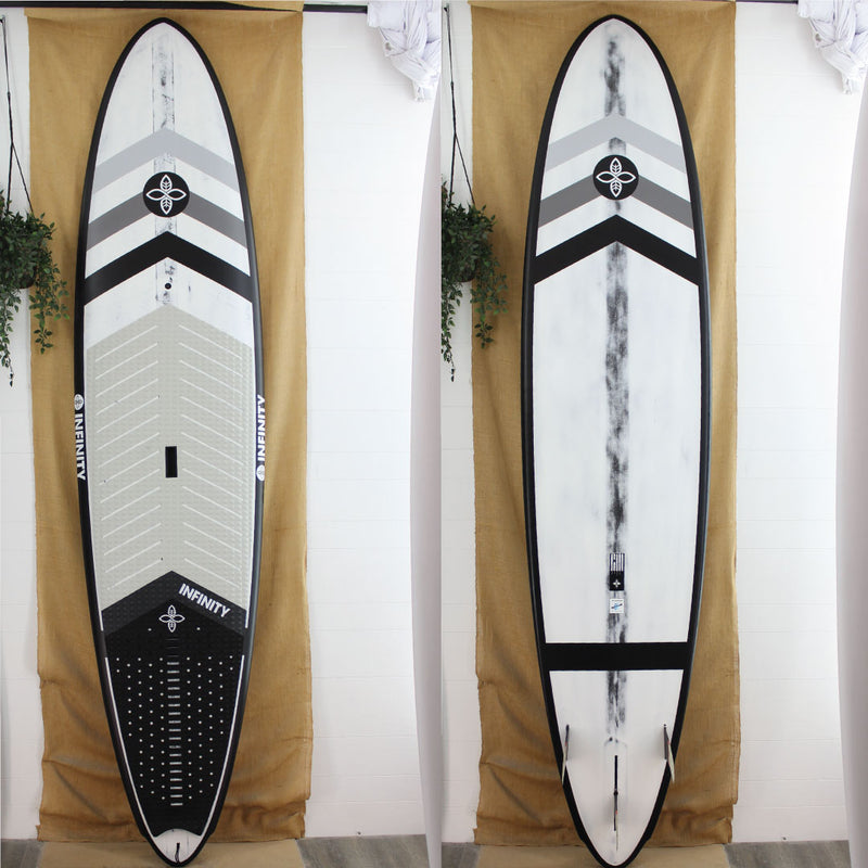 Infinity SUP with a black and white design on a beige curtain background