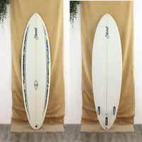 Deck and bottom view of a Stewart Wild Bill with a clear bottom and a clear deck with some green and blue artwork on the rails