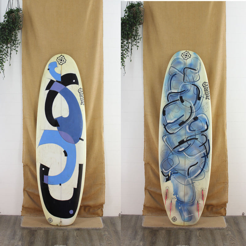 deck and bottom view of used Shuler Shortboard with blue and black artwork on the deck and bottom 