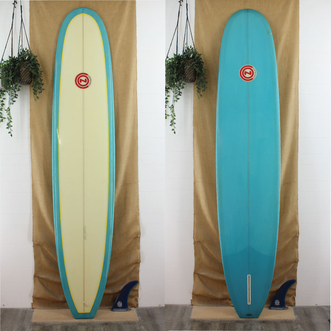 Con Blue resin tint surfboard with blue bottom and rails and yellow pinline