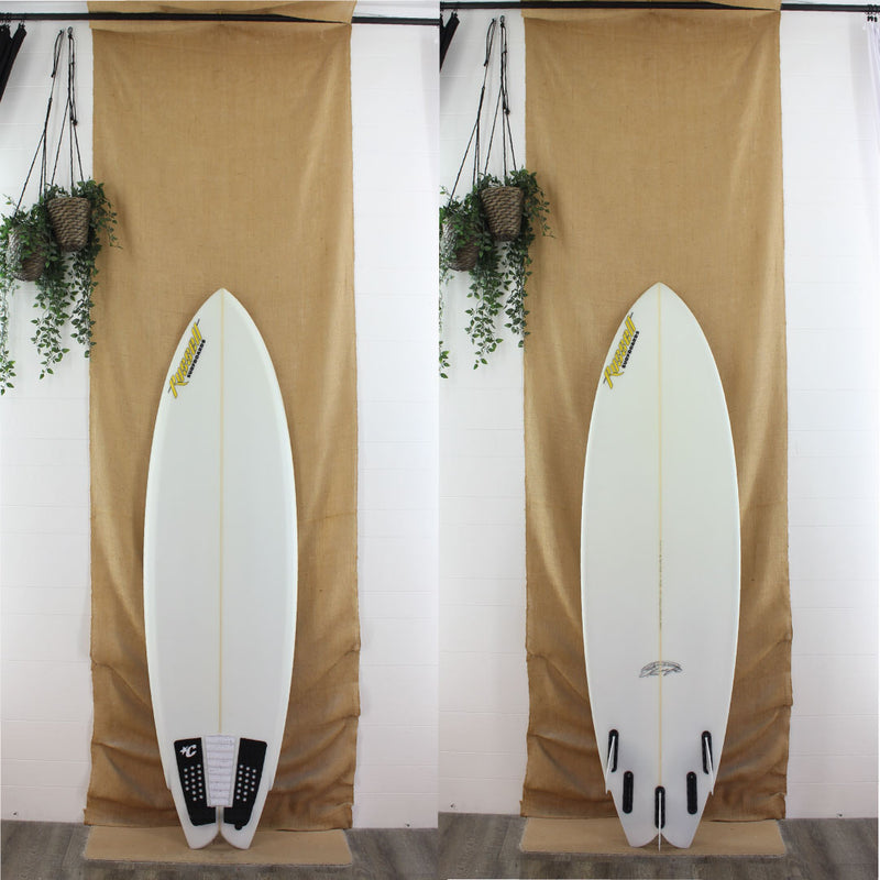 used clear russel shortboard with fins and traction 