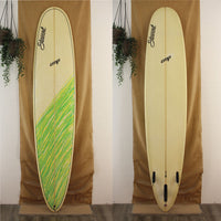 USED Stewart CMP longboard 9'2" x 23 3/4" x 2 3/4" EPS with green and yellow streaks across tail to mid board on the top deck 
