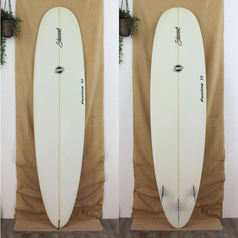 Deck and bottom view of a used Stewart Funline 11 Mid Length with no color and sand finish 