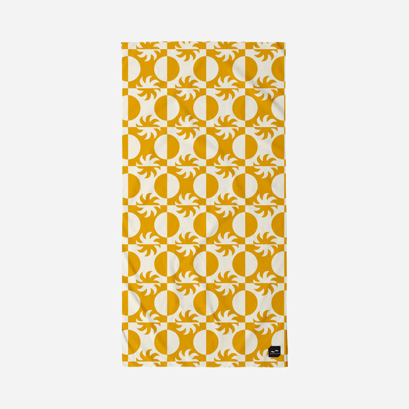 Towel with yellow and white geometric pattern on a white background