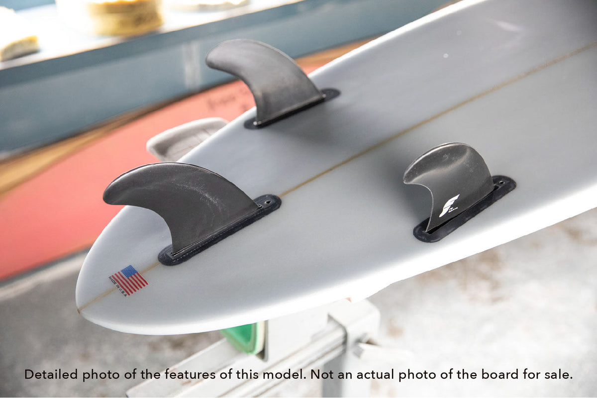 detail of the fins included with a Funline 11 midlength funboard surfboard