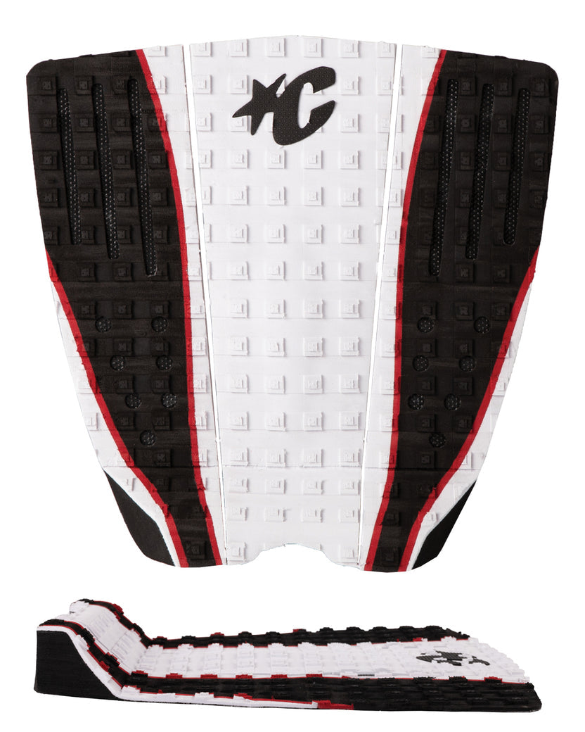 A black, white, and red surfboard tail pad shown from the back, featuring a textured grip pattern, a black stylized 'XC' logo, and a separate matching adhesive backing strip displayed below on a white background.