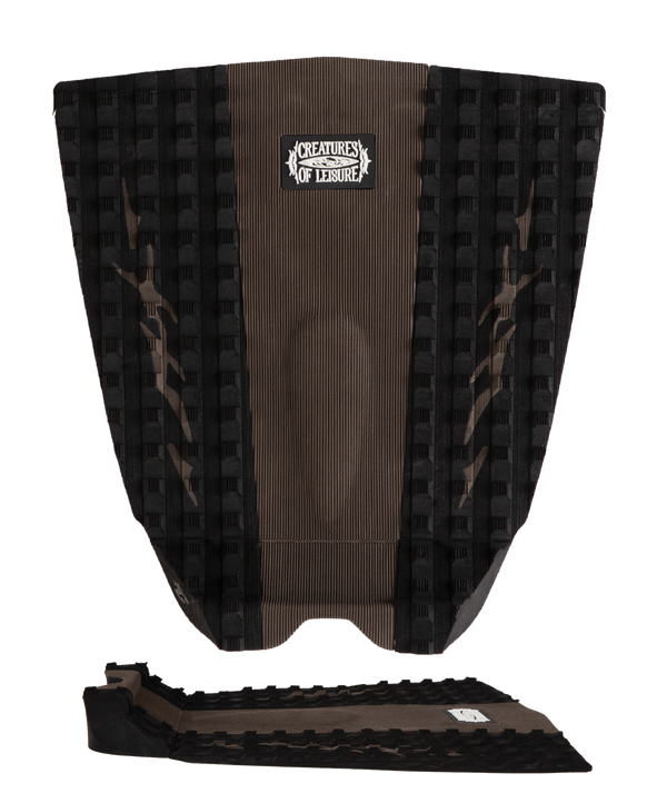Brown and black textured surfboard deck with a logo on a white background