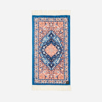 Decorative rug with intricate patterns on a white background
