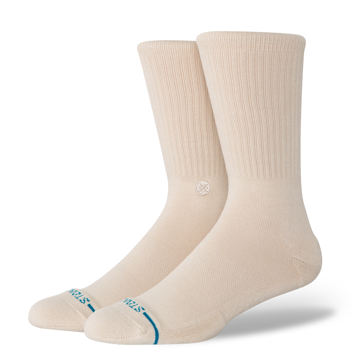Pair of beige socks with a brand logo on a white background