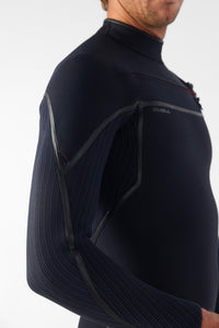 Person wearing a black wetsuit with a visible brand logo on a white background