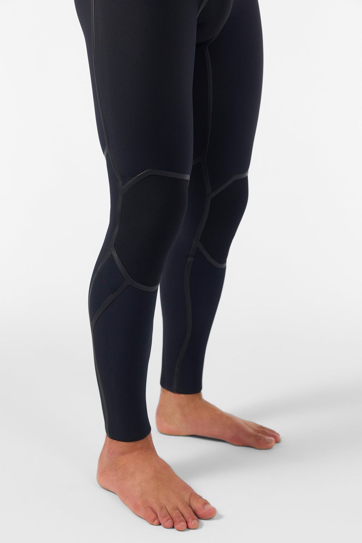 Black wetsuit leggings on a white background