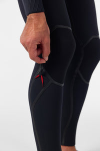 Close-up of a person wearing a black wetsuit with a red zipper on a white background